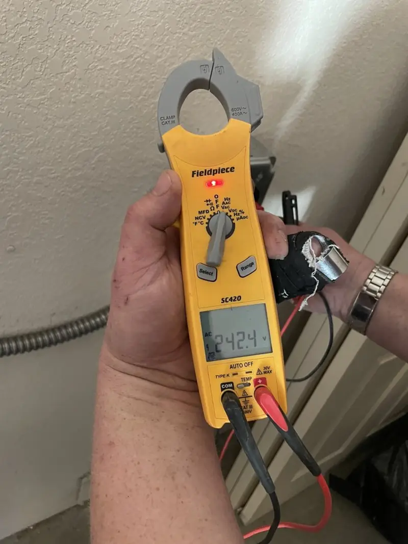 Voltage testing with clamp meter during Electrical Installation Services in Bernalillo